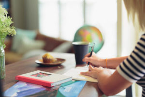 Woman writing on a notebook